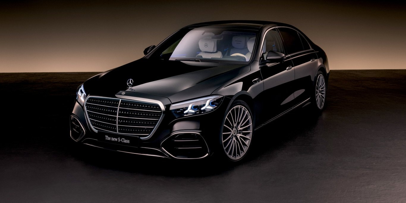 Mercedes-Benz S-Class in black on a coastal mountain road, a model not carried in Brunei